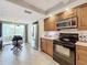 Modern kitchen featuring stainless steel appliances and ample cabinetry at 6609 Stone River Rd # 104, Bradenton, FL 34203