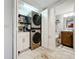 Convenient laundry room with washer, dryer, and extra storage at 6609 Stone River Rd # 104, Bradenton, FL 34203