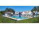 Relaxing community pool area with ample seating at 6609 Stone River Rd # 104, Bradenton, FL 34203