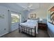 Cozy bedroom with natural light, ceiling fan, and comfortable furnishings at 6629 Pleasant Hill Rd, Bradenton, FL 34203