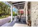 Relaxing back porch with seating area and lush landscaping at 1923 Hibiscus St, Sarasota, FL 34239