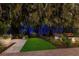 Landscaped backyard at night with illuminated bamboo at 1923 Hibiscus St, Sarasota, FL 34239