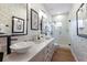 Clean bathroom with double sinks, a walk-in shower, and mosaic tile at 1923 Hibiscus St, Sarasota, FL 34239