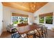 Bright dining area with a live edge wood table, and large windows at 1923 Hibiscus St, Sarasota, FL 34239