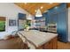 Open kitchen boasting blue cabinetry, large island, and farmhouse sink at 1923 Hibiscus St, Sarasota, FL 34239