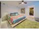 Bright bedroom with a king-size bed and colorful bedding at 315 Palmetto W Rd, Nokomis, FL 34275