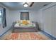 Bedroom with a daybed, window, and ample closet space at 315 Palmetto W Rd, Nokomis, FL 34275