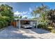 Covered carport with a white car parked inside at 315 Palmetto W Rd, Nokomis, FL 34275