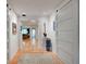 Hallway with barn door and view into living room at 315 Palmetto W Rd, Nokomis, FL 34275