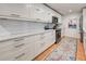 Modern white kitchen with stainless steel appliances and ample counter space at 315 Palmetto W Rd, Nokomis, FL 34275