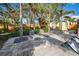 Relaxing lounge chairs in the sunny poolside area at 315 Palmetto W Rd, Nokomis, FL 34275