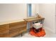 Modern vanity with wood top and cowhide stool at 315 Palmetto W Rd, Nokomis, FL 34275