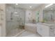 Modern bathroom with a large walk-in shower and a soaking tub at 3431 79Th Street W Cir # 102, Bradenton, FL 34209