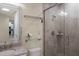 Bathroom with shower, granite vanity, and glass shelf at 3431 79Th Street W Cir # 102, Bradenton, FL 34209