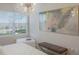 Bright bedroom with large window, chandelier, and art at 3431 79Th Street W Cir # 102, Bradenton, FL 34209