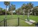 Fenced dog park with trees, benches, and water fountain at 3431 79Th Street W Cir # 102, Bradenton, FL 34209