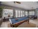 Game room with pool table and seating area at 3431 79Th Street W Cir # 102, Bradenton, FL 34209