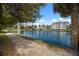 Peaceful lakefront view with walking path and lush landscaping at 3431 79Th Street W Cir # 102, Bradenton, FL 34209