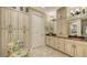 Elegant bathroom with double vanity, granite counters, and ample storage at 3625 Tin Cup Blvd, Sarasota, FL 34232