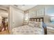 Charming bedroom with a bed, closet, and view of kitchen at 3625 Tin Cup Blvd, Sarasota, FL 34232