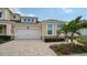 Inviting exterior of a two-story house with a paved driveway and landscaping at 3625 Tin Cup Blvd, Sarasota, FL 34232