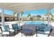 Relaxing seating area under a pergola near pool at 3625 Tin Cup Blvd, Sarasota, FL 34232