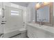 Modern bathroom with white vanity, bathtub, and updated fixtures at 4001 17Th W Ave, Bradenton, FL 34205