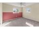 Well-lit bedroom with neutral carpeting and two windows at 4001 17Th W Ave, Bradenton, FL 34205