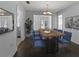 Bright dining room with hardwood floors and modern chandelier at 4001 17Th W Ave, Bradenton, FL 34205