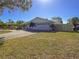 Single-story home with a two-car garage and a spacious lawn at 4001 17Th W Ave, Bradenton, FL 34205