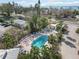 Aerial view of resort pool, hot tub, and tennis court at 5310 Gulf Of Mexico Dr # 11, Longboat Key, FL 34228