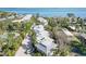 Aerial view of waterfront community with lush landscaping and private driveways at 5310 Gulf Of Mexico Dr # 11, Longboat Key, FL 34228