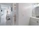 Modern bathroom with a vanity and a view of a bedroom at 5310 Gulf Of Mexico Dr # 11, Longboat Key, FL 34228