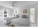 Guest bedroom with two twin beds, offering a relaxing and comfortable atmosphere at 5310 Gulf Of Mexico Dr # 11, Longboat Key, FL 34228