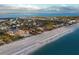 Aerial view of beachfront homes; one under construction, ocean view at 5965 Gulf Of Mexico Dr, Longboat Key, FL 34228