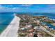 Expansive aerial view of beachfront homes and community at 5965 Gulf Of Mexico Dr, Longboat Key, FL 34228