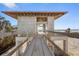 Elevated walkway to beach house under construction at 5965 Gulf Of Mexico Dr, Longboat Key, FL 34228