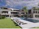 Luxury home rendering; large pool, patio furniture, tropical landscaping at 5965 Gulf Of Mexico Dr, Longboat Key, FL 34228