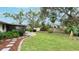 Landscaped backyard, featuring a patio and lush greenery at 6201 34Th W Ave, Bradenton, FL 34209