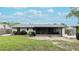 Backyard oasis with screened porch and expansive lawn at 6201 34Th W Ave, Bradenton, FL 34209