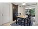 Small dining area with dark wood table, chairs, and barn door at 6201 34Th W Ave, Bradenton, FL 34209