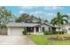 Single story home with attached garage and landscaped front yard at 6201 34Th W Ave, Bradenton, FL 34209