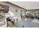 Relaxing screened patio with seating area and rug at 6201 34Th W Ave, Bradenton, FL 34209