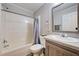 Bathroom features a shower-tub combination, and a vanity with countertop and storage at 6824 Haawi Ct, North Port, FL 34287