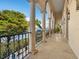 Elegant balcony overlooking the water with arched columns and iron railings at 749 Freeling Dr, Sarasota, FL 34242