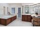 Luxurious bathroom with a soaking tub, double vanity, and a makeup vanity at 749 Freeling Dr, Sarasota, FL 34242