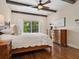 Bedroom with bamboo bed frame and sliding glass doors at 749 Freeling Dr, Sarasota, FL 34242