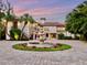 Grand waterfront home with circular driveway and fountain at 749 Freeling Dr, Sarasota, FL 34242