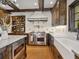 Bright kitchen with a farmhouse sink, stainless steel appliances, and decorative tile at 749 Freeling Dr, Sarasota, FL 34242