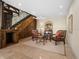 Basement sitting area with two armchairs, a chess table, and a wood-paneled wall at 749 Freeling Dr, Sarasota, FL 34242